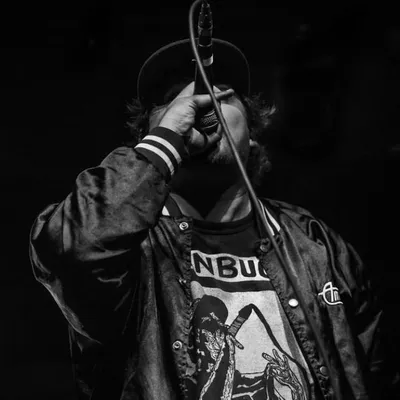 Ben Buck on the mic, in black and white